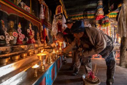 Faithful light candles, Milarepa Grotto temple, Annapurna Circuit, Nepal