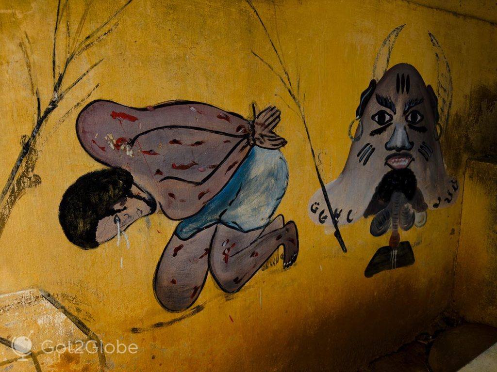 Pintura que ilustra o deus vigia da noite Zangbeto a castigar um infractor